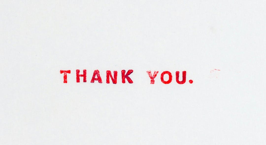 Text "THANK YOU." printed in red ink on a plain white background.