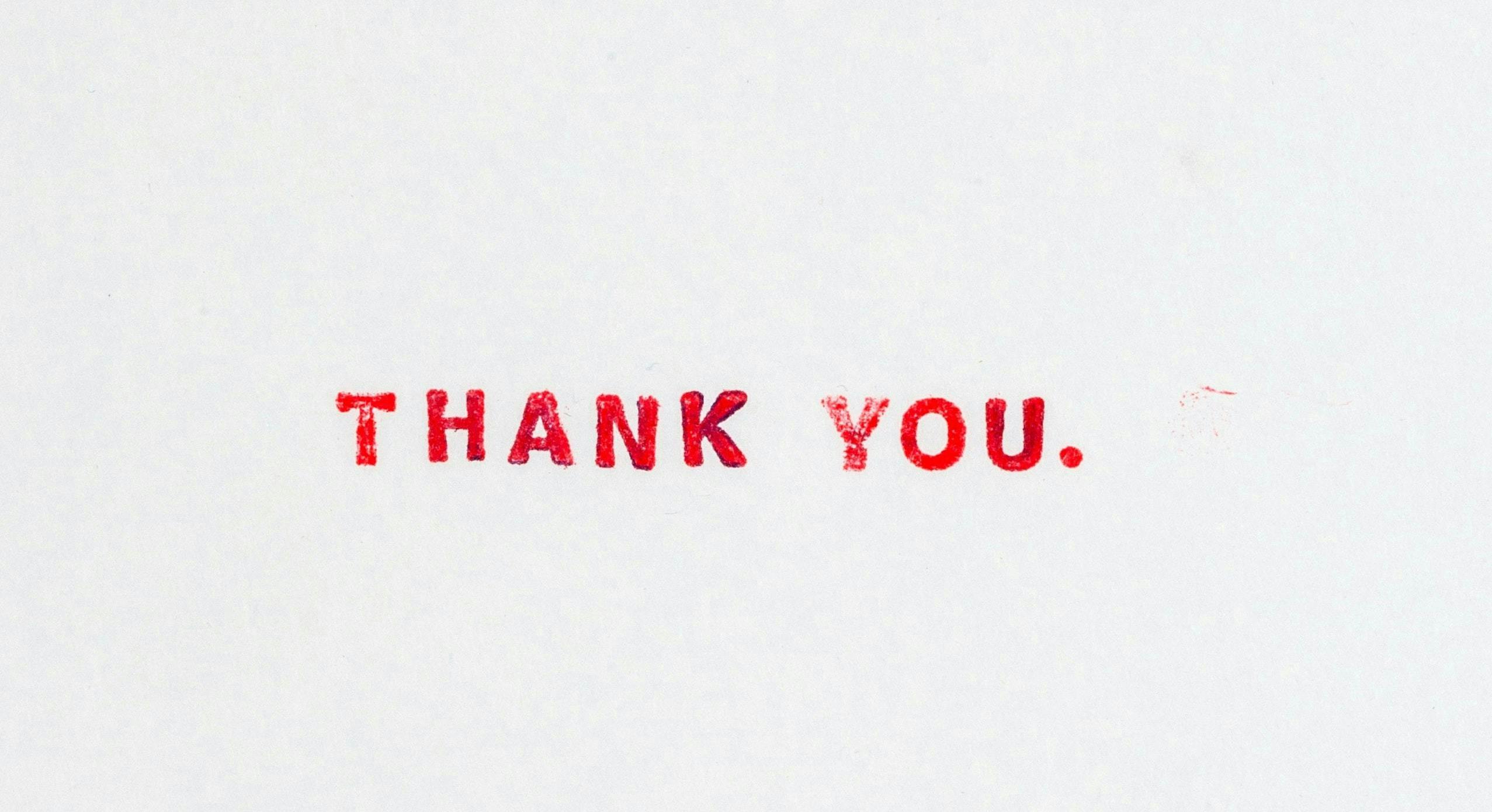 Text "THANK YOU." printed in red ink on a plain white background.