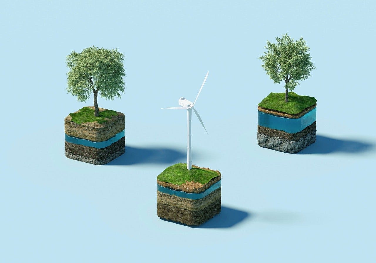Three suspended cross-sectional soil blocks, each with layered soil strata. Two blocks have trees, and the central block features a wind turbine, all against a light blue background.