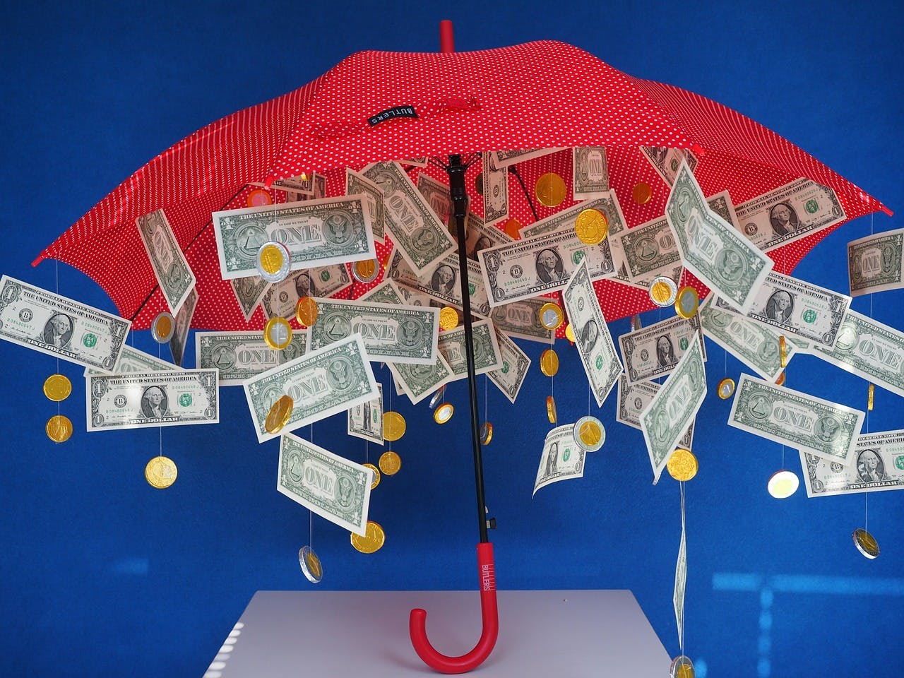 money hanging from an umbrella