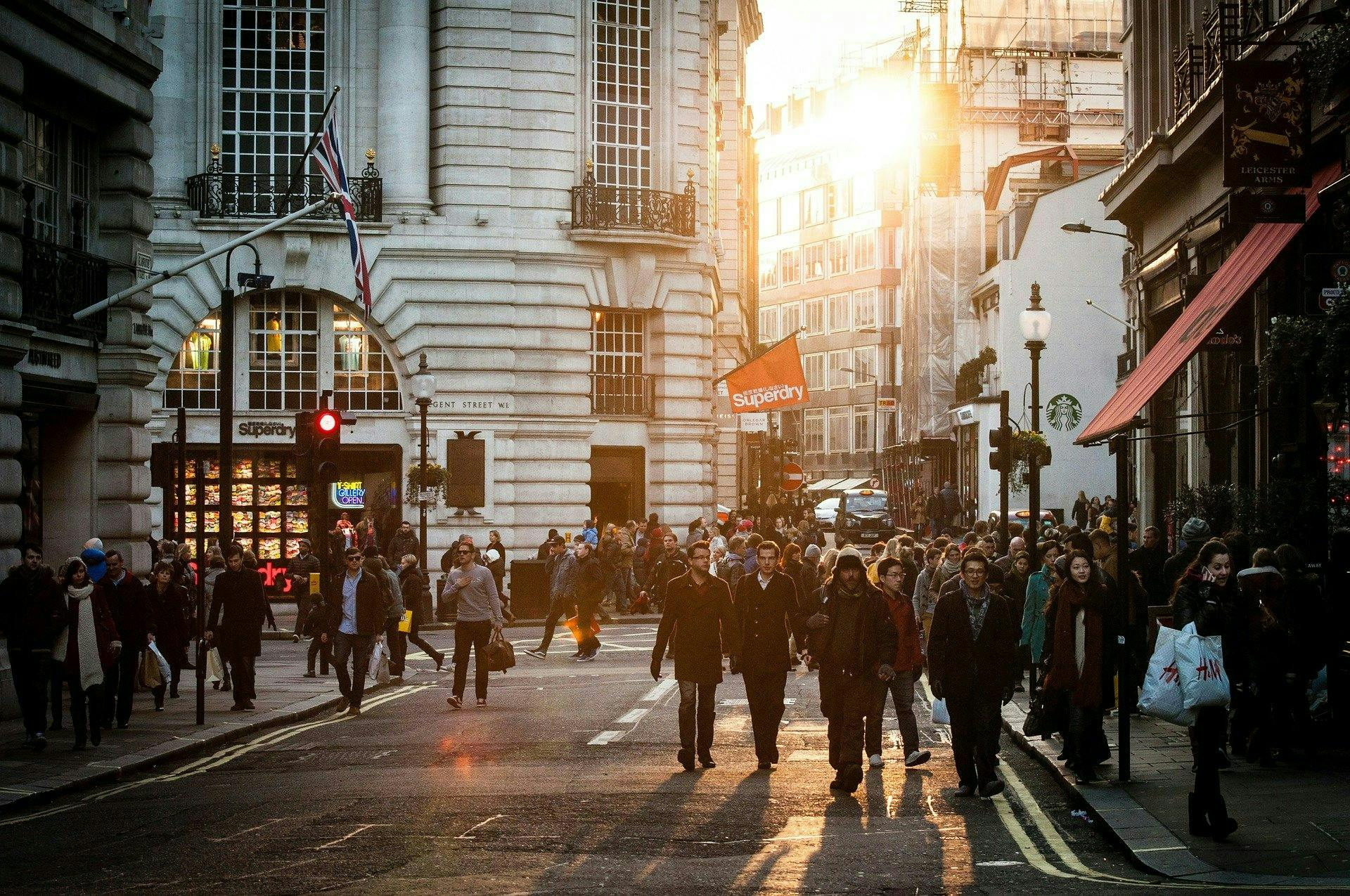urban sunset with people walking