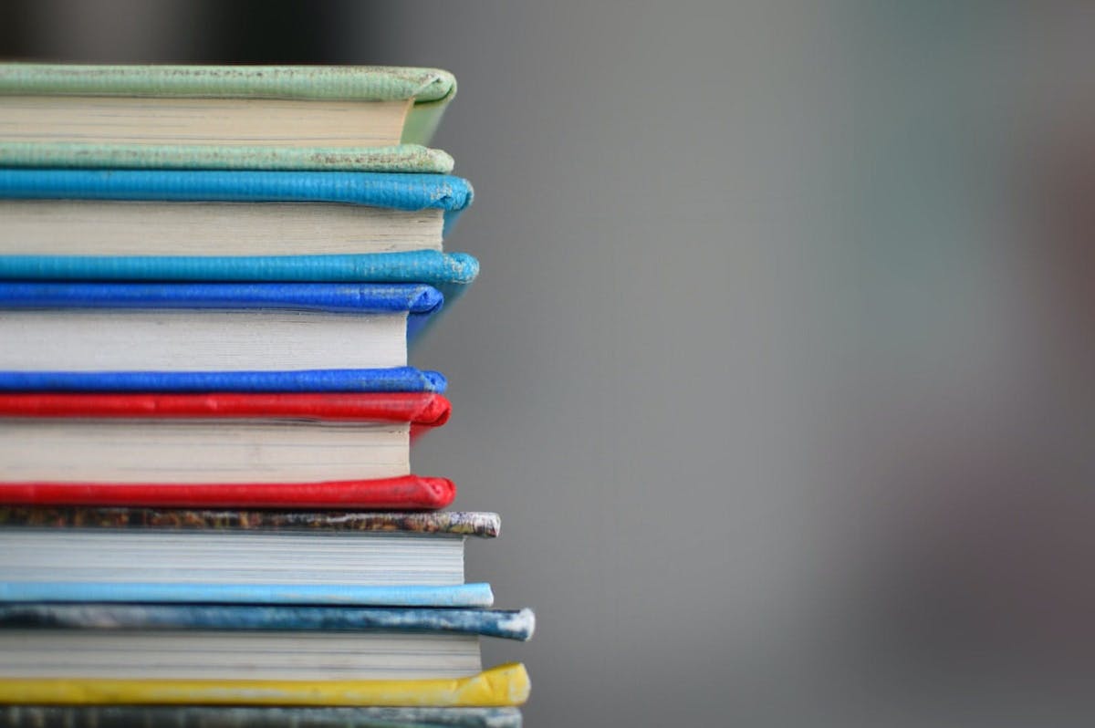 A stack of books in a classroom