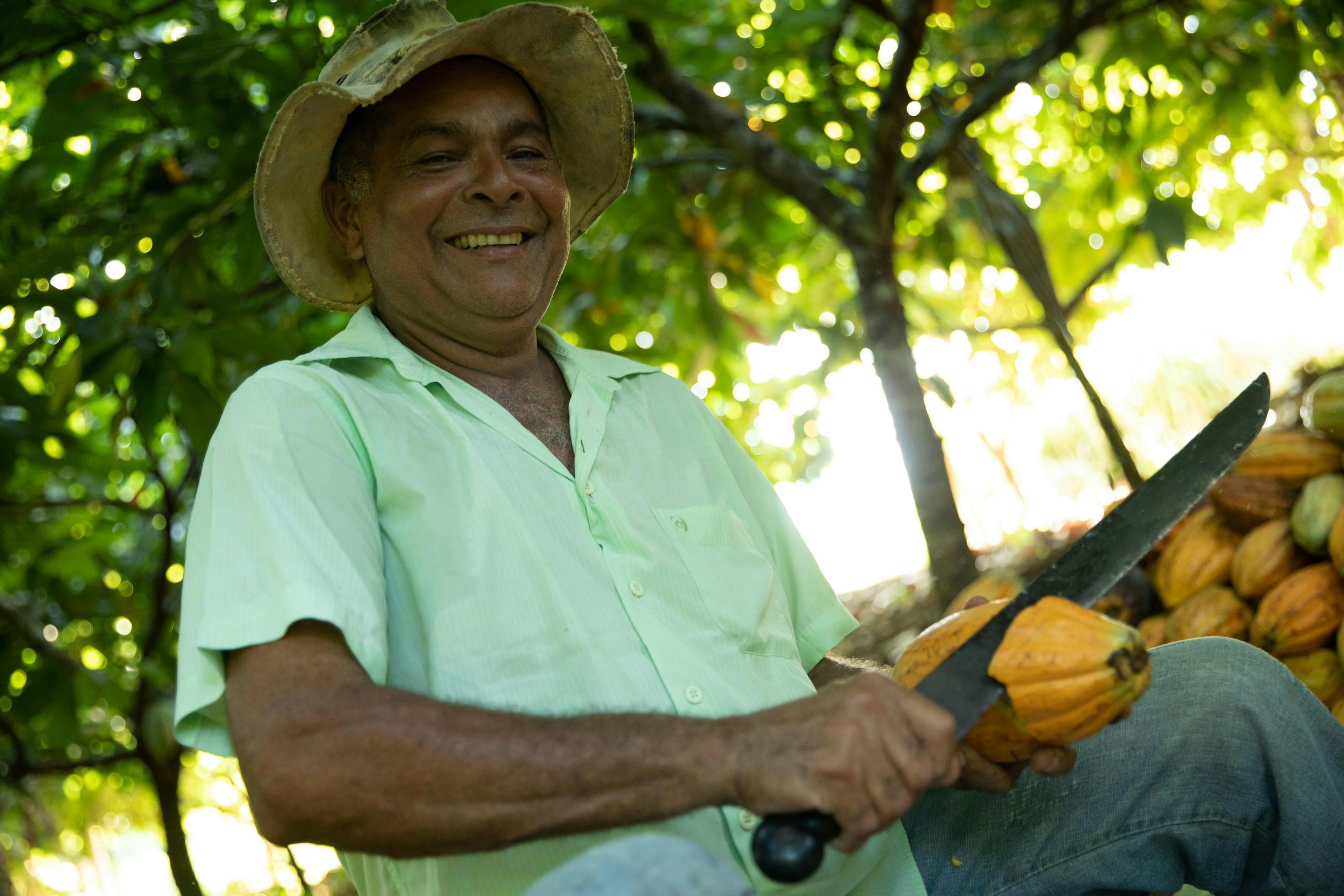 Brazilian farmer Joao Evangelista with a knife and cacao fruit
