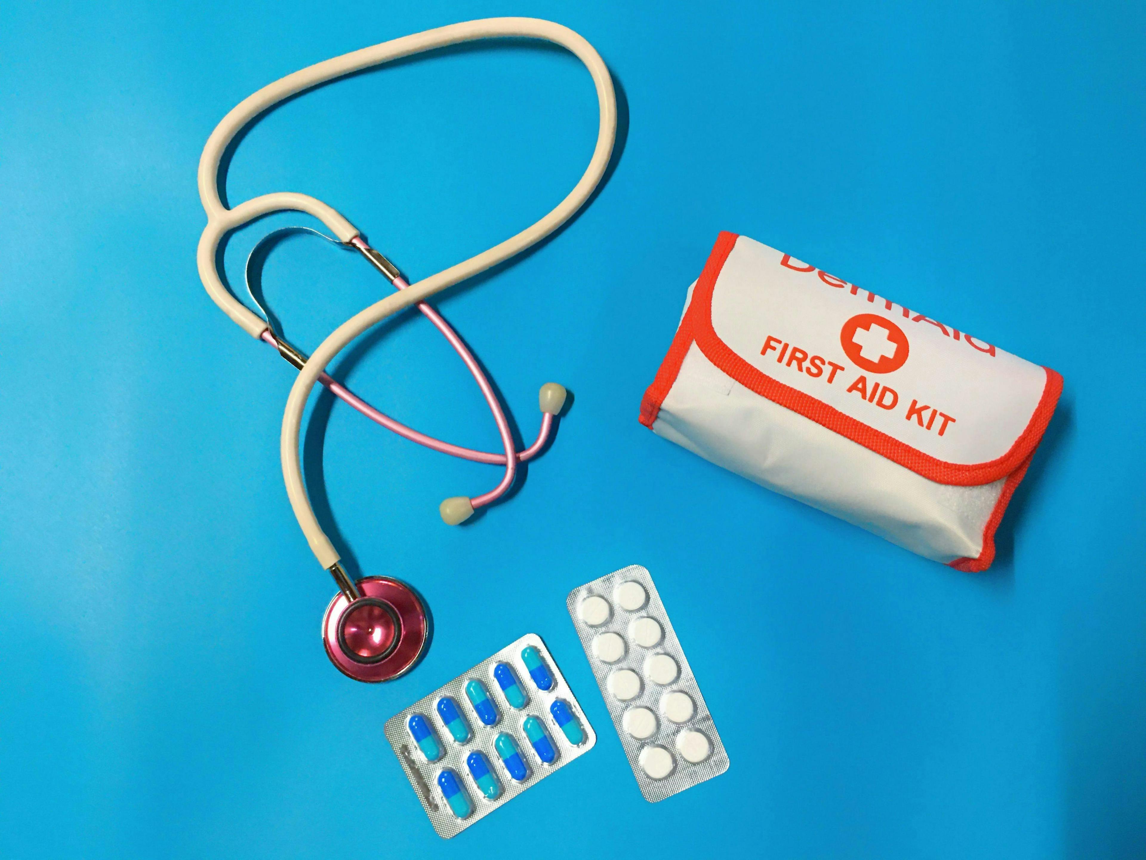 stethoscope pills and first aid kit