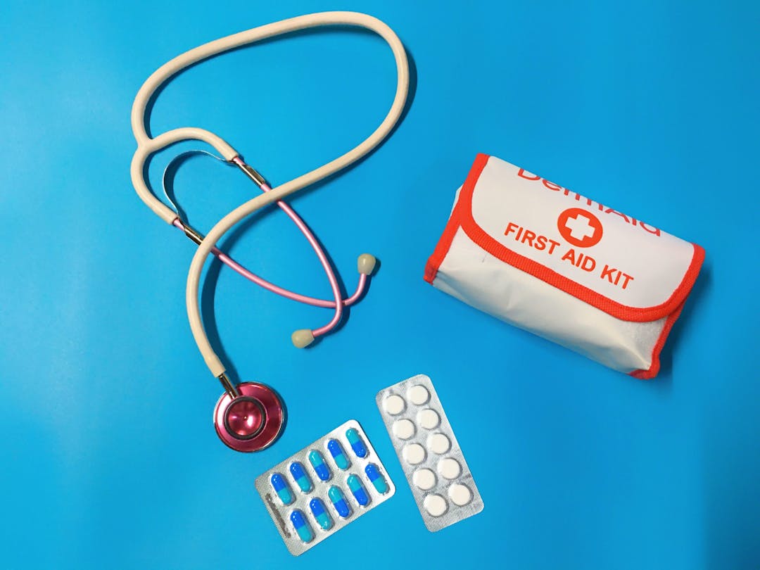 stethoscope pills and first aid kit