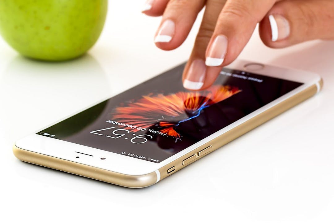Image of hand touching a smart phone